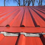 Colorsteel roof cladding with soft edge closure sealing flashing around rib profile to prevent water entry