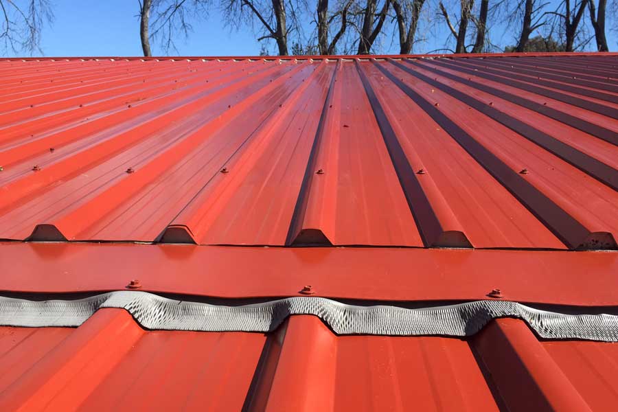 Colorsteel roof cladding with soft edge closure sealing flashing around rib profile to prevent water entry